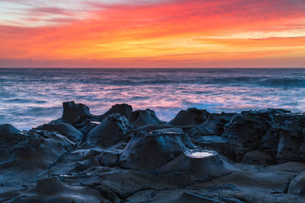 istock High Cloud Sunrise Seascape from Rock Platform 1303063136