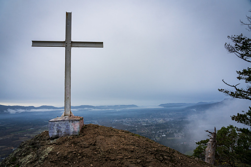Viewpoint from Mount Tzouhalem with a cross on the top overlooking the valley of North Cowichan, Vancouver Island.