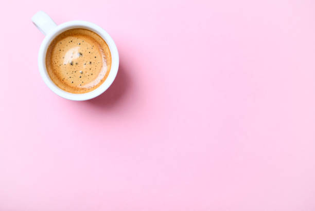 istock Cup of coffee on bright  background. Top view. 1303070650