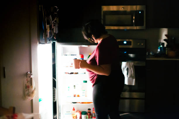 istock Pregnant Woman Getting A Snack at Midnight 1303073846