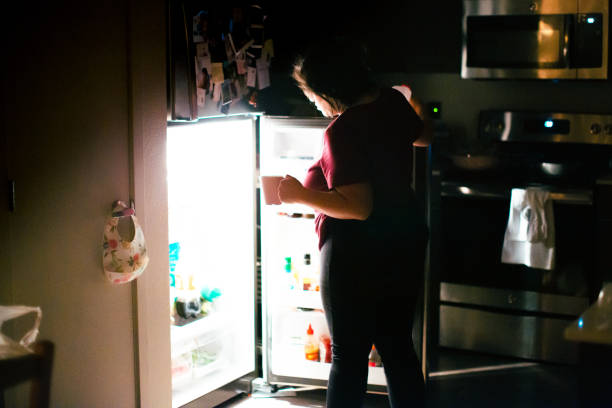 istock Pregnant Woman Getting A Snack at Midnight 1303073864