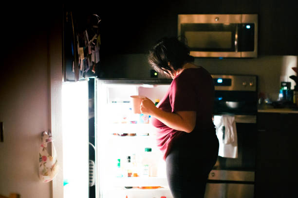 istock Pregnant Woman Getting A Snack at Midnight 1303073869