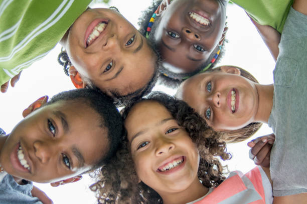 istock Multi ethnic group of happy elementary age children 1303076003