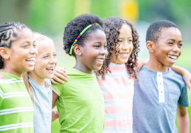 istock Multi ethnic group of children outdoors together 1303076007