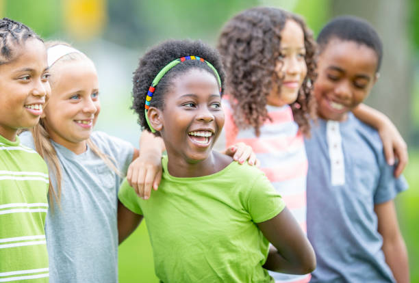 istock Multi ethnic group of children outdoors together 1303076009