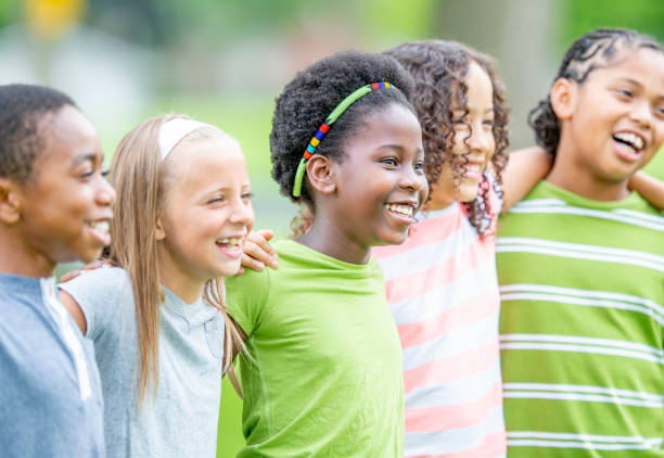 istock Multi ethnic group of children outdoors together 1303076010