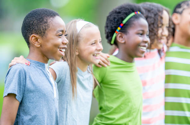 istock Multi ethnic group of children outdoors together 1303076013