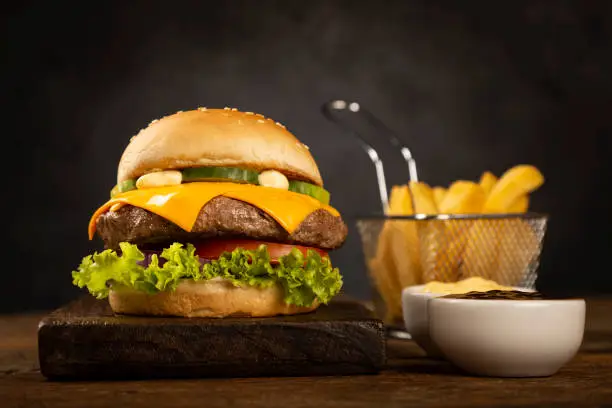 Delicious hamburger on dark background