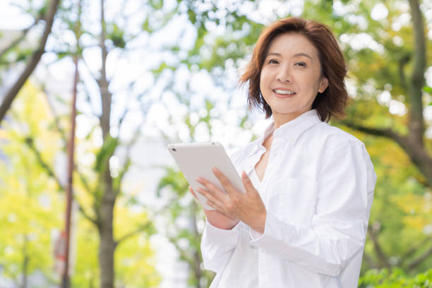 istock senior age woman who uses tablet computer 1303080502