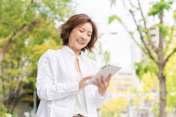 istock senior age woman who uses tablet computer 1303080527