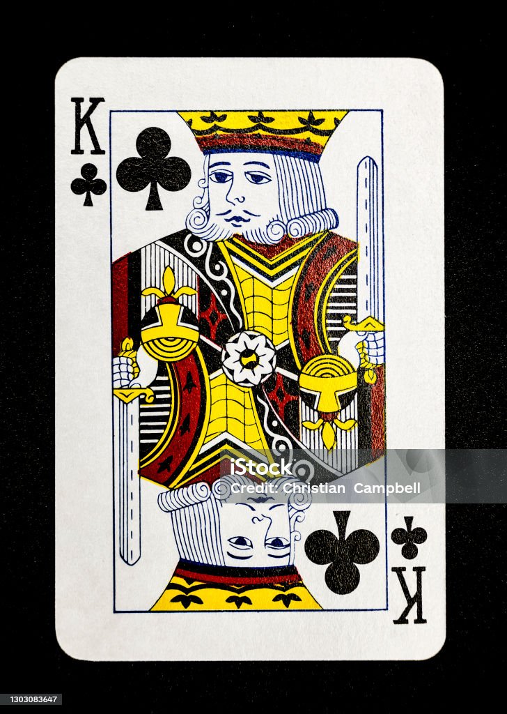 King of clubs playing card on black Series of the suit Clubs from a common deck of cards. All images on a black background. King Card Stock Photo