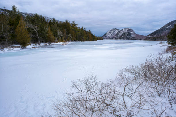istock Frozen Winter Lake and Mountains 1303087830