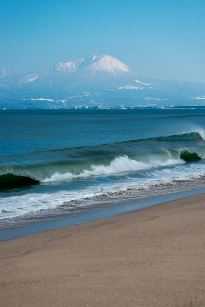 istock Crashing waves and a view of Mt. Daisen (Tottori) 1303088681