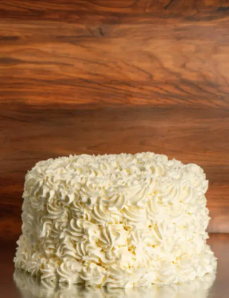Classic rosette icing sponge cake. Detailed food background.