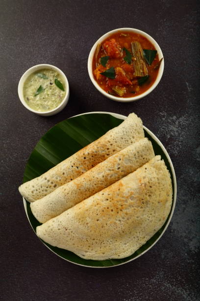 istock Crispy fried dosa with curry. South Indian breakfast. 1303091805
