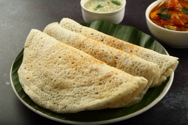 istock Crispy fried dosa with curry. South Indian breakfast. 1303091840