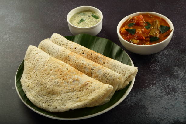istock Crispy fried dosa with curry. South Indian breakfast. 1303091844