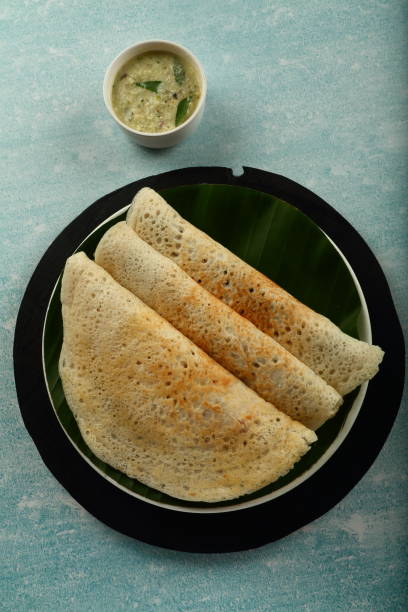 istock Healthy vegan diet- dosa with curry. 1303091909