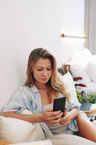 istock Young woman with smartphone 1303094820