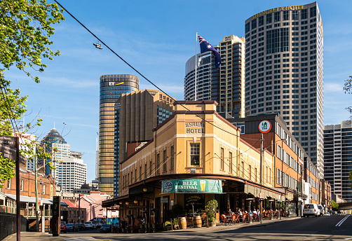 Sydney, Australia - October 3 2019: The traditional architecture of the Australian Heritage hotel and pub contrasts with modern towers in the Sydney Rocks district on a sunny day