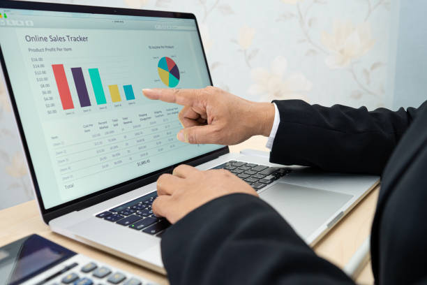 istock Asian accountant working and analyzing financial reports project accounting with chart graph and calculator in modern office, finance and business concept. 1303097957
