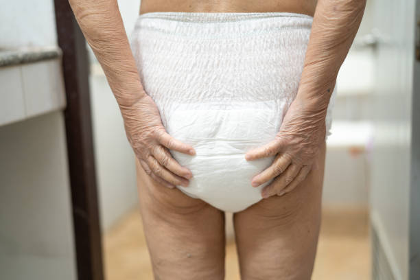 Asian senior or elderly old lady woman patient wearing incontinence diaper in nursing hospital ward, healthy strong medical concept. Asian senior or elderly old lady woman patient wearing incontinence diaper in nursing hospital ward, healthy strong medical concept. adult diaper stock pictures, royalty-free photos & images
