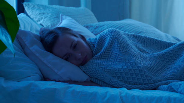 istock Woman in a bed can't fall asleep. Insomnia concept 1303101408