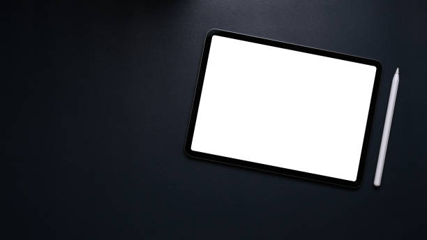 istock Flat lay mock up digital tablet with blank screen and digitizer pen on black leather. 1303103083