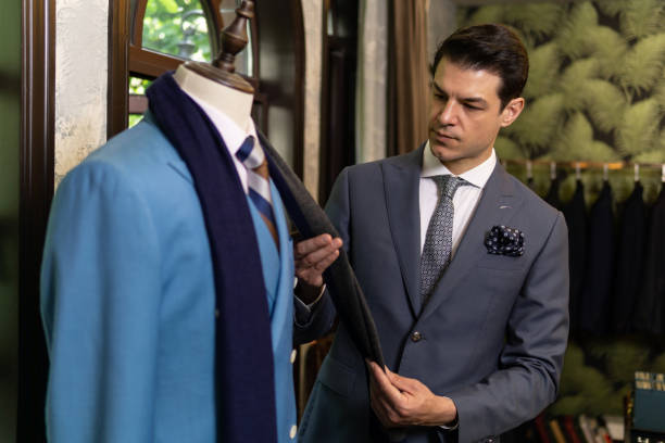 istock Man looking for new suit in costume store. 1303107026