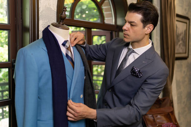 istock Man looking for new suit in costume store. 1303107035