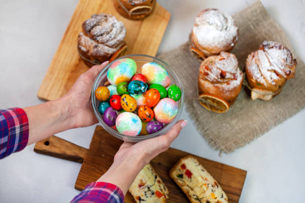 istock Easter cake Kraffin (Cruffin), with nuts and candied fruit sprinkled with powdered sugar, 2021 trend of the easter cake. 1303107883