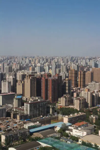 Top view of XI'an city.Panorama. Lots of high-rise buildings, demolition of old houses, a Park against the blue sky.