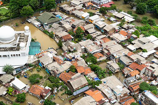 The flooded street in a poor residential district in the heart of Jakarta city in Indonesia capital city