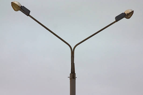 istock a tall pole with two lamps at the top 1303108711