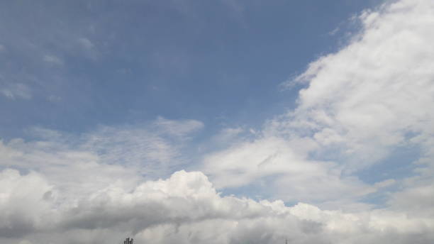 istock White clouds on a blue sky background, in the daytime 1303109494