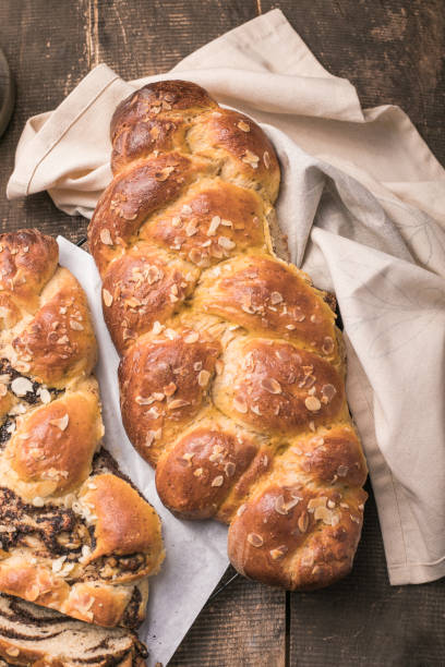 istock Tsoureki braid, greek easter sweet bread, on wood 1303109496