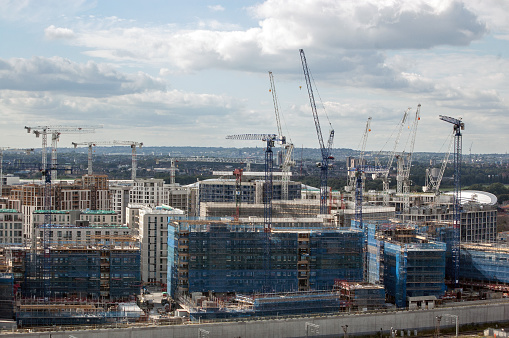 London, UK - September 18, 2010:  View across the construction site where accommodation is being built for athletes attending the London Olympic Games of 2012.  The Velodrome is to the right hand side.
