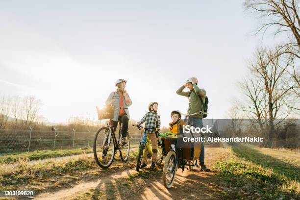 Family On A Bike Ride Stock Photo - Download Image Now - Family, Cycling, Bicycle