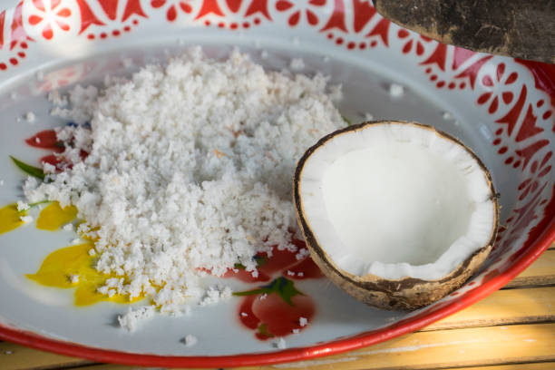 istock Coconut cut in half and coconut flakes around 1303109895
