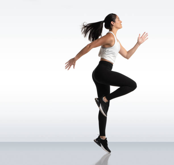 istock Athletic woman in sportswear doing one hand side push ups 1303110589