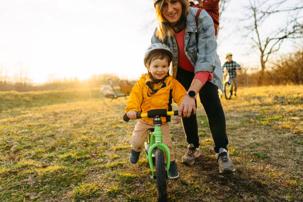 istock Little boy's learning to ride a bicycle 1303110824