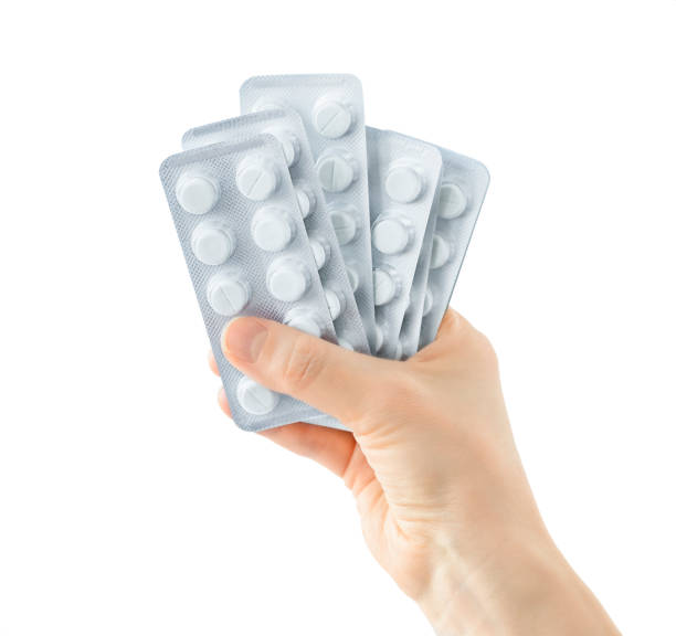 istock Blisters of pills in hand 1303114310