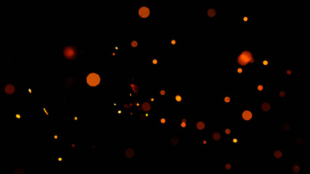 istock Orange bokeh on a black background, burning and blurred sparks from the fire. 1303115376