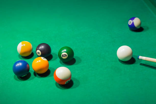 istock Billiard balls on pool green table 1303115767