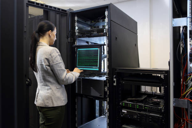 istock Female IT professional in server room 1303116609