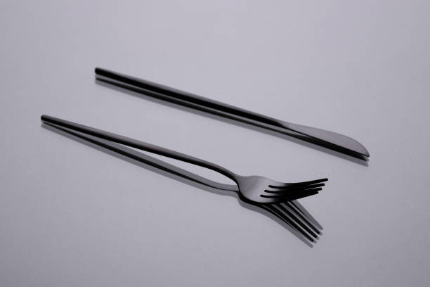 istock Cutlery on a gray background with shadow. Table serving 1303117045