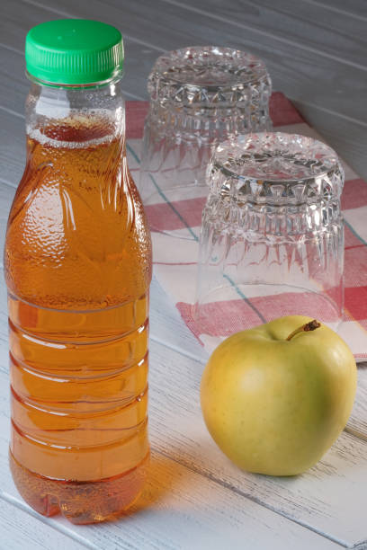 istock Apple juice in a plastic bottle 1303118141
