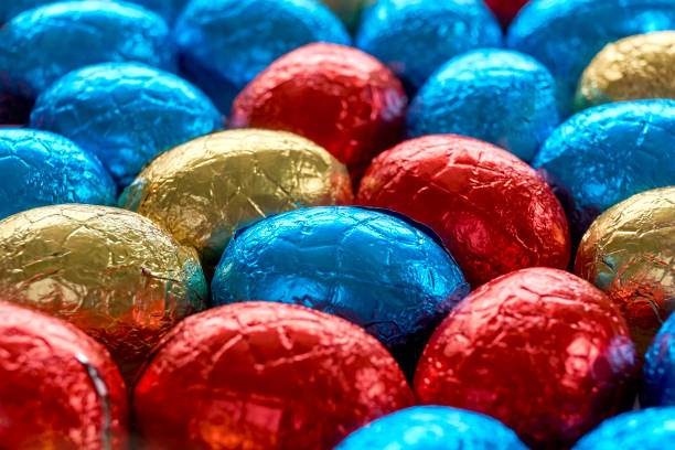 istock Chocolate easter eggs wrapped in blue, red and golden foil 1303118608