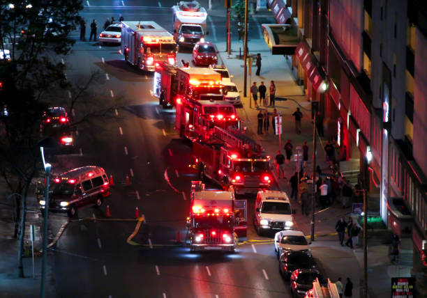 Calgary, Alberta, Canada. Feb 20, 2021. Calgary Fire Department trucks responding to an emergency on a building downtown. Calgary Hook, Ladder and Bucket Corps