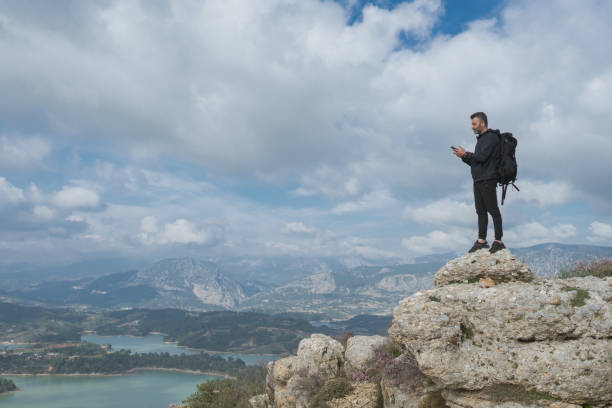 istock Hiker on mountains checks his smartphone. 1303122109